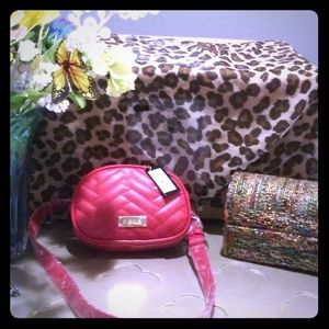 Red Bebe clutch with long strap